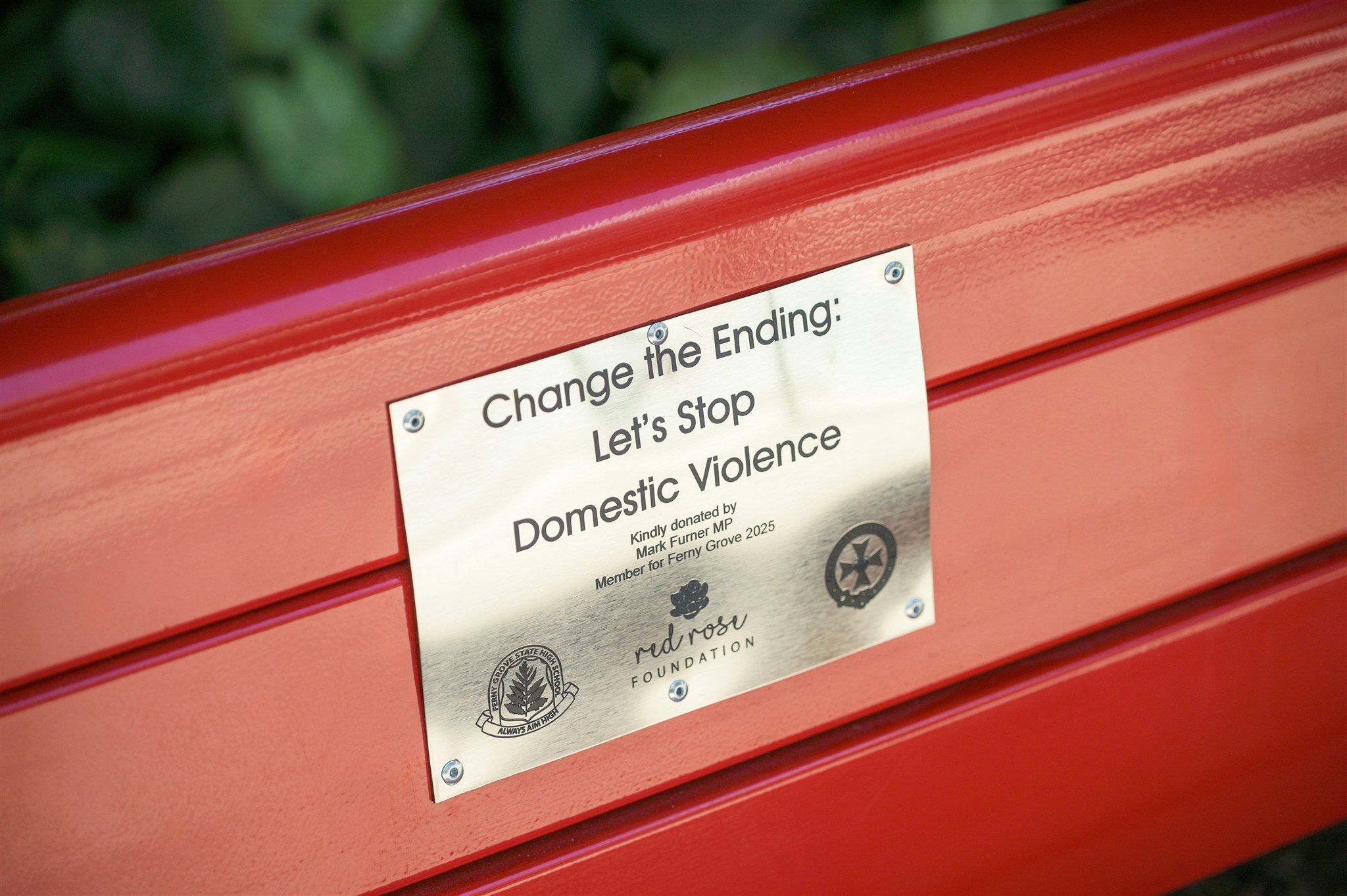 Ferny Grove State High School Red Bench Project featuring GX Outdoors Integra Ex Park Seat installed at the school campus