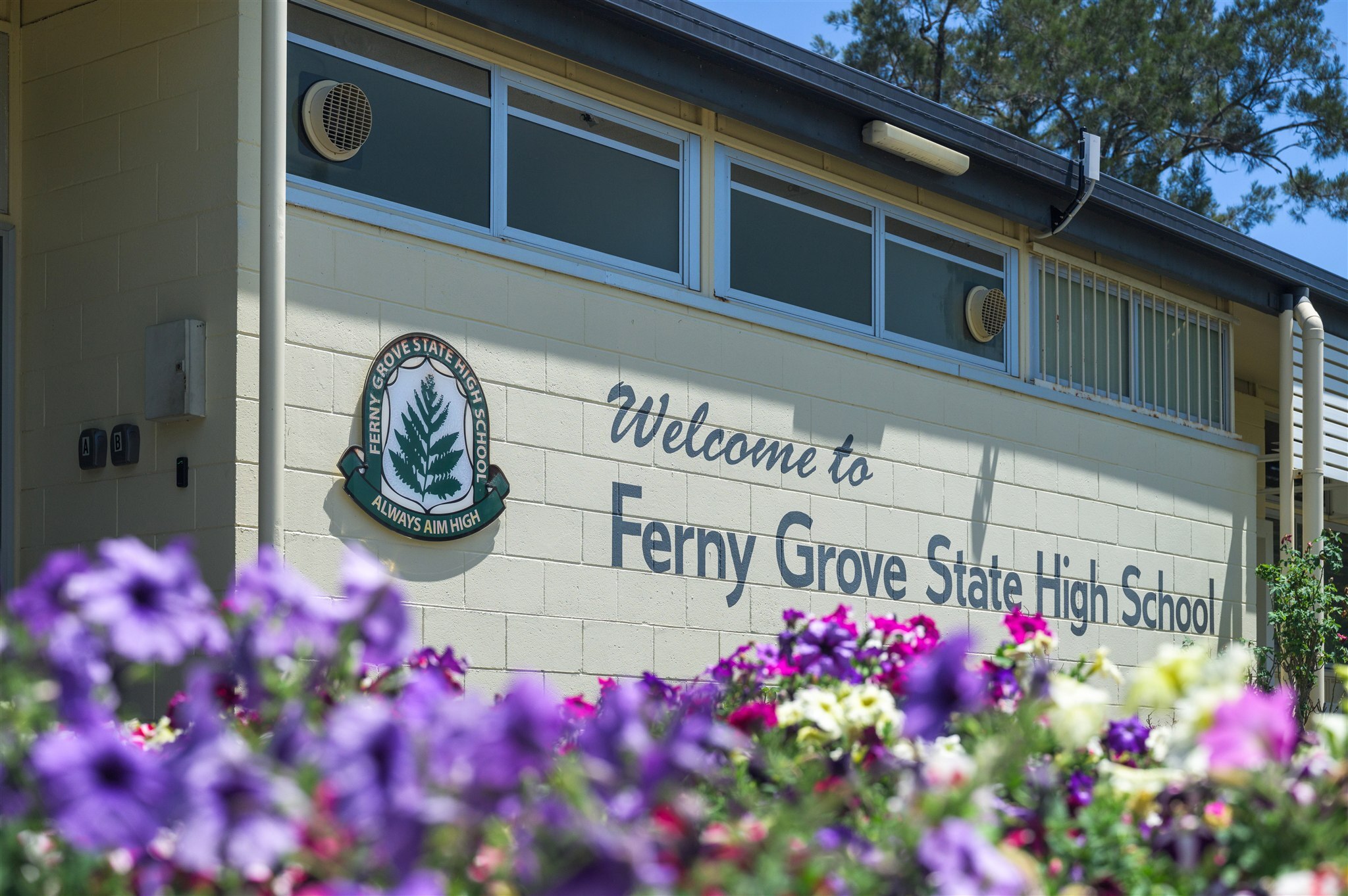 Ferny Grove State High School Red Bench Project featuring GX Outdoors Integra Ex Park Seat installed at the school campus